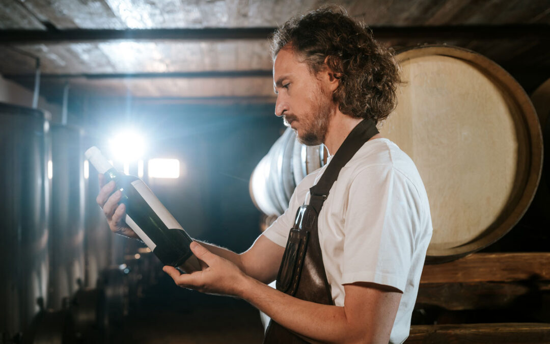 winery worker picking a bottle of wine for customers