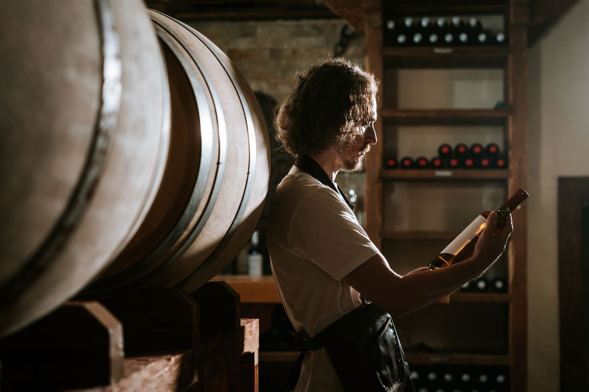 wine maker in barrel room